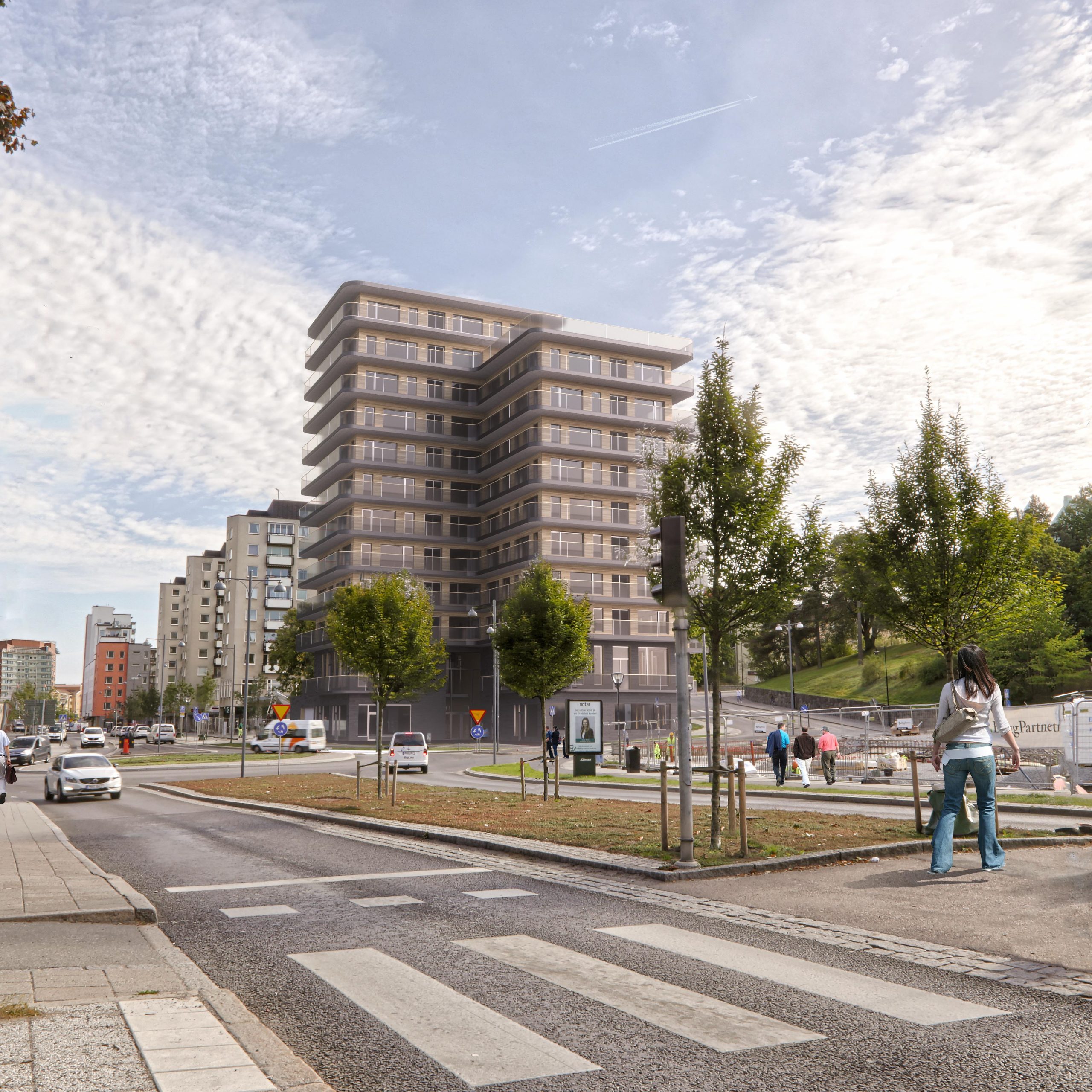 3D-visualisering av flerbostadshus vid gata med rondell och stadsmiljö
